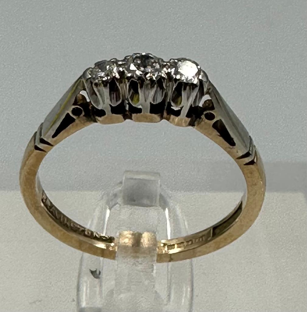 A 9ct gold and platinum three stone diamond ring, size L. - Image 4 of 6