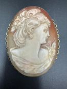 A 9ct gold Cameo of a lady in a classical pose.