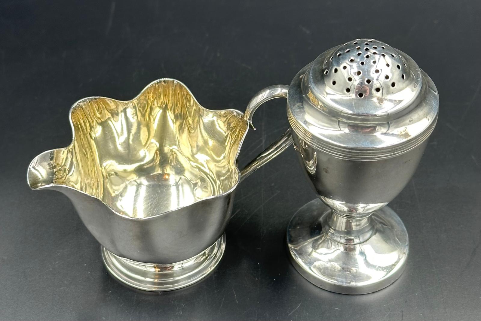 A Mappin & Webb silverplated milk jug and an unmarked pepper pot. - Image 2 of 3
