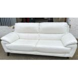 A white leather three seater sofa 212cm x 87cm