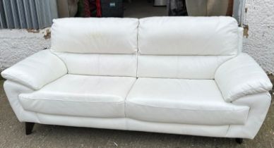 A white leather three seater sofa 212cm x 87cm