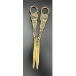A pair of silver grape scissors, with a total weight of 131g and floriate design hallmarked for