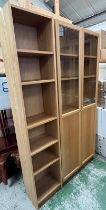 A double and single glazed bookcase/display unit