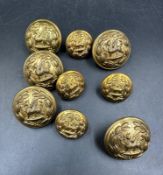 A small selection of brass military buttons.