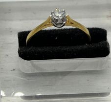 An 18ct, marked 750 diamond ring, size P1/2
