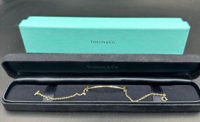 A Tiffany & Co Tiffany T Smile bracelet in 18ct yellow gold in original box.