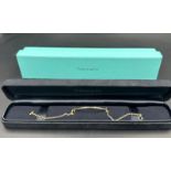 A Tiffany & Co Tiffany T Smile bracelet in 18ct yellow gold in original box.