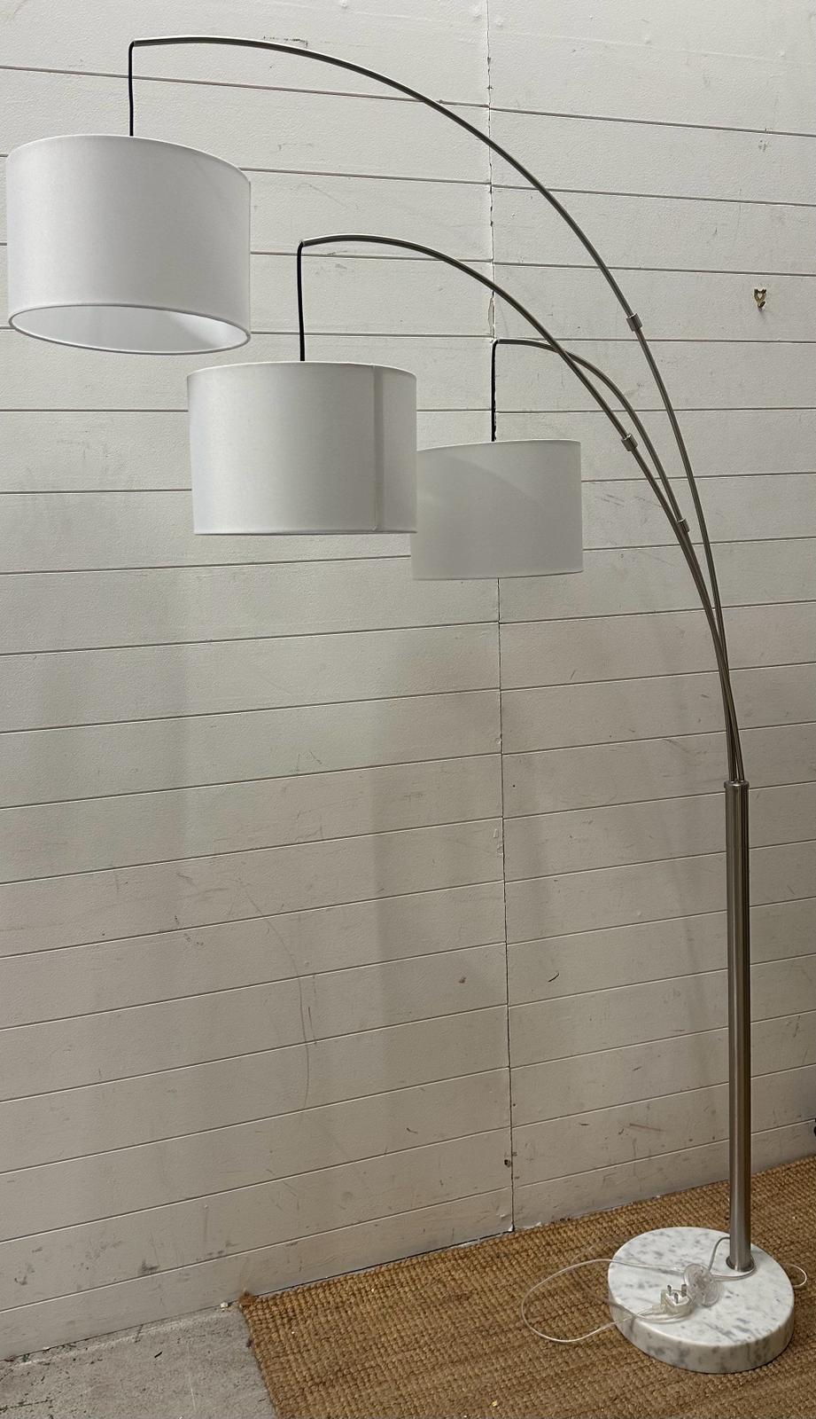 An Angus three arm arch floor lamp in brush steel on marble base (two meter)