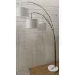 An Angus three arm arch floor lamp in brush steel on marble base (two meter)