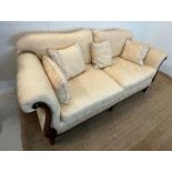 A large two seater sofa with scrolling wooden frame by Medallion (H83cm W197cm D94cm SH53cm)