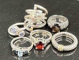 A selection of six silver fashion rings, various styles and finishes