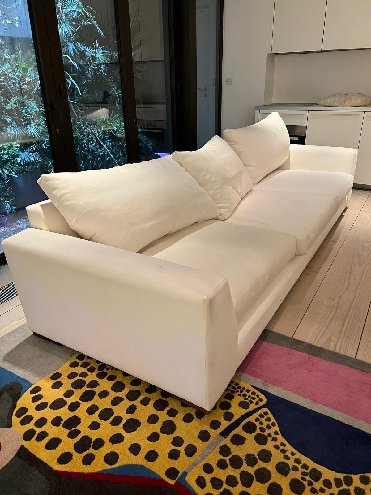 A large white sofa (H57cm D102cm SH42cm W320cm approx)