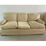 Three seater cream sofa by Peter Dudgeon (W210cm D98cm SH49cm)
