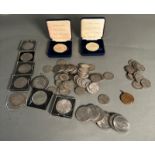A selection of Great British coins to include Crowns, Florins and several medallions.