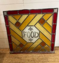 A lead glass panel with the words food AF (76cm x 76cm) Condition Report some cracks to the glass