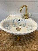 A French porcelain hung clock room basin with blue floral decoration (37cm x 30cm
