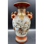 A Japanese Kunai ware Satsuma vase decorated with a lakeside scene featuring Geisha girls and gilt