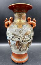 A Japanese Kunai ware Satsuma vase decorated with a lakeside scene featuring Geisha girls and gilt
