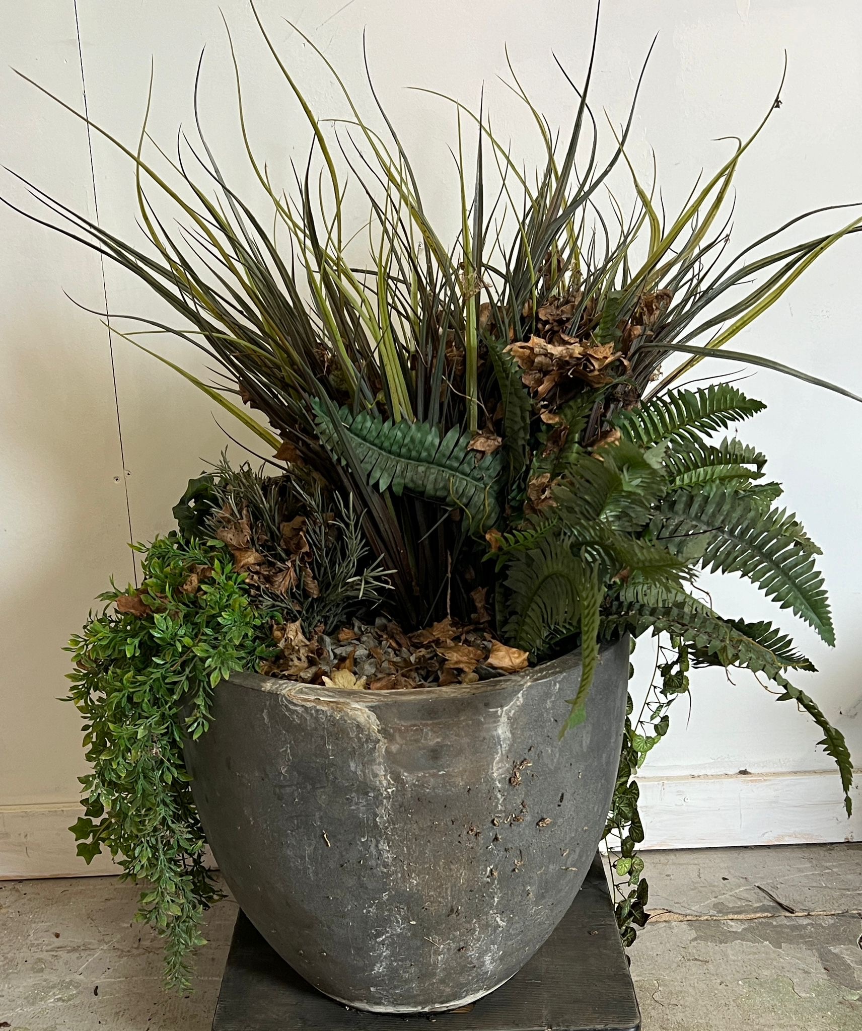 An artificial grass and ivy plants in a slate style pot planter (H46cm Dia46cm)