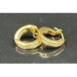 A Gold diamond hoop earrings mounted in 18ct gold. Signed T&Co. Total diamond weight approximately