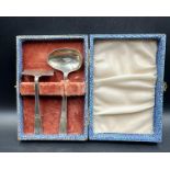 A silver boxed spoon and pusher christening set hallmarked for Birmingham 1947 by Hamilton Utilities