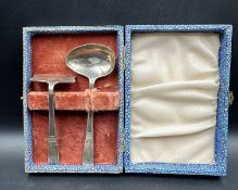 A silver boxed spoon and pusher christening set hallmarked for Birmingham 1947 by Hamilton Utilities