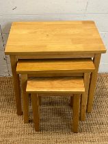 A set of light oak nesting tables (H46cm W48cm D33cm)