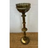 A brass Gothic candle holder alter pieces