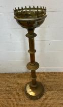 A brass Gothic candle holder alter pieces