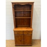A pine dresser with open shelves upon a cupboard base (H180cmW80cm D43cm) Condition Report general