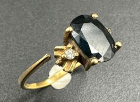 An 18ct gold sapphire ring with diamond shoulders AF