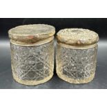 Two hallmarked silver lidded cut glass vanity jars