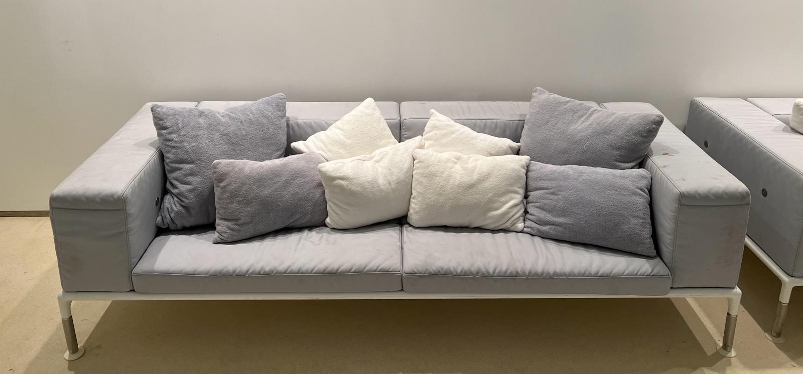 A grey outdoor sofa by B &B Italia outdoor spring time (H73cm W260cm D97cm)