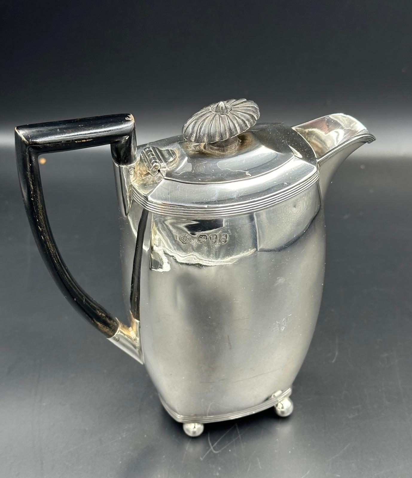 A silver coffee pot with ebonised handle and finial, approximate total weight 297g, height 17cm on