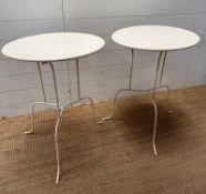 A pair of metal bistro tables (H68cm Dia51cm)