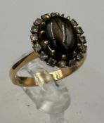 A gold tigers eye ring with diamonds AF SIze M