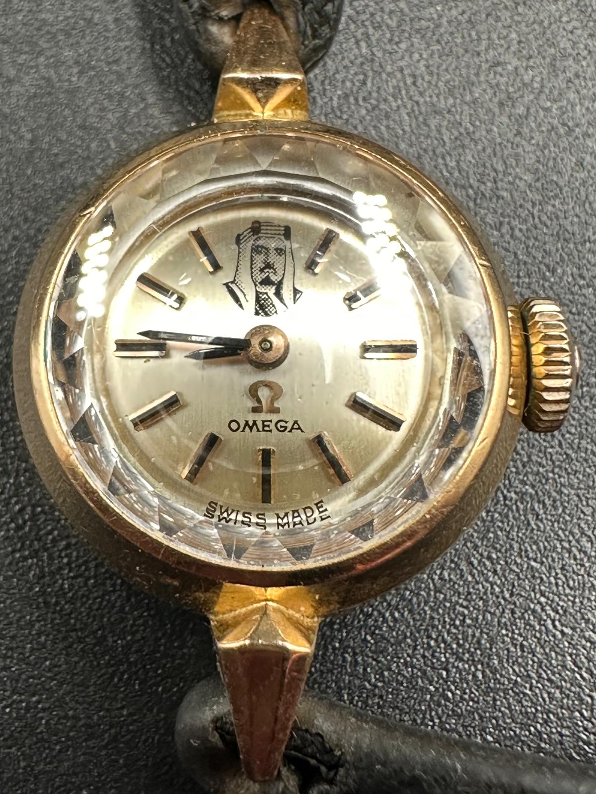 A rare ladies Omega gold watch on leather bracelet with image of a Sheik's head. - Image 4 of 4