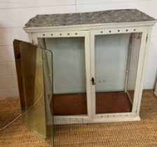 A vintage shop display cabinet or medical cabinet with one glass shelf and one mirrored shelf (