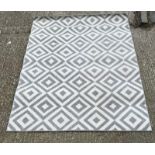 A contemporary rug in a grey and white geometric pattern 160cm x 220cm