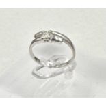 A contemporary white gold and diamond ring, size I