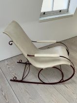 A late Victorian rocking chair with wrought iron frame , upholstered later (H92cm W102cm D53cm)