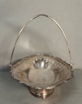 A Georgian silver basket with handle and pig armorial to base of bowl, with an approximate total