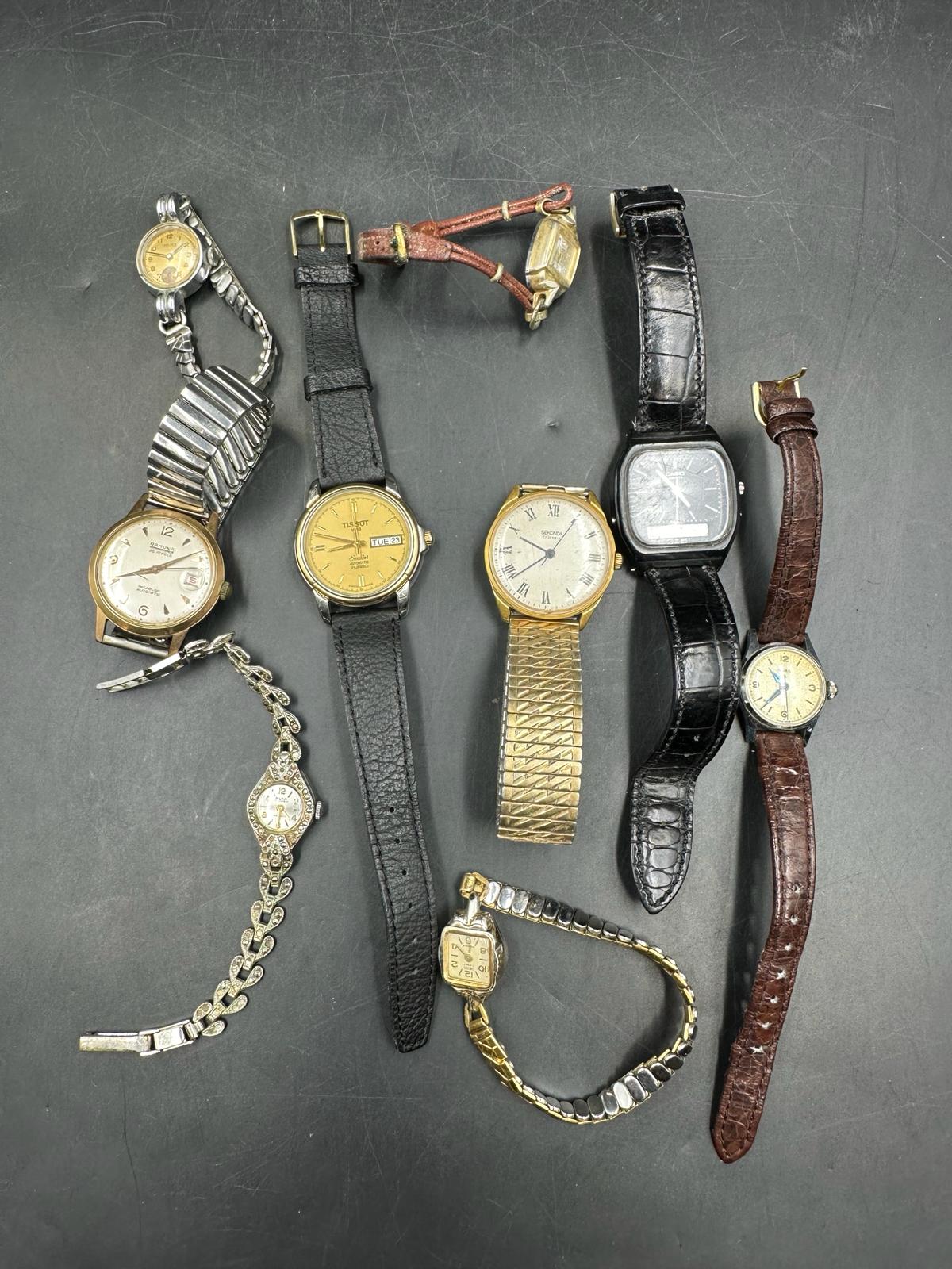 A selection of ladies and gentleman's wrist watches to include Tissot, Sekonda and Casio
