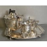A three piece silver tea service to include a teapot, milk jug, and sugar bowl by Watson & Gillott
