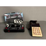 A vintage Blip digital game and a cased Rockwell calculator