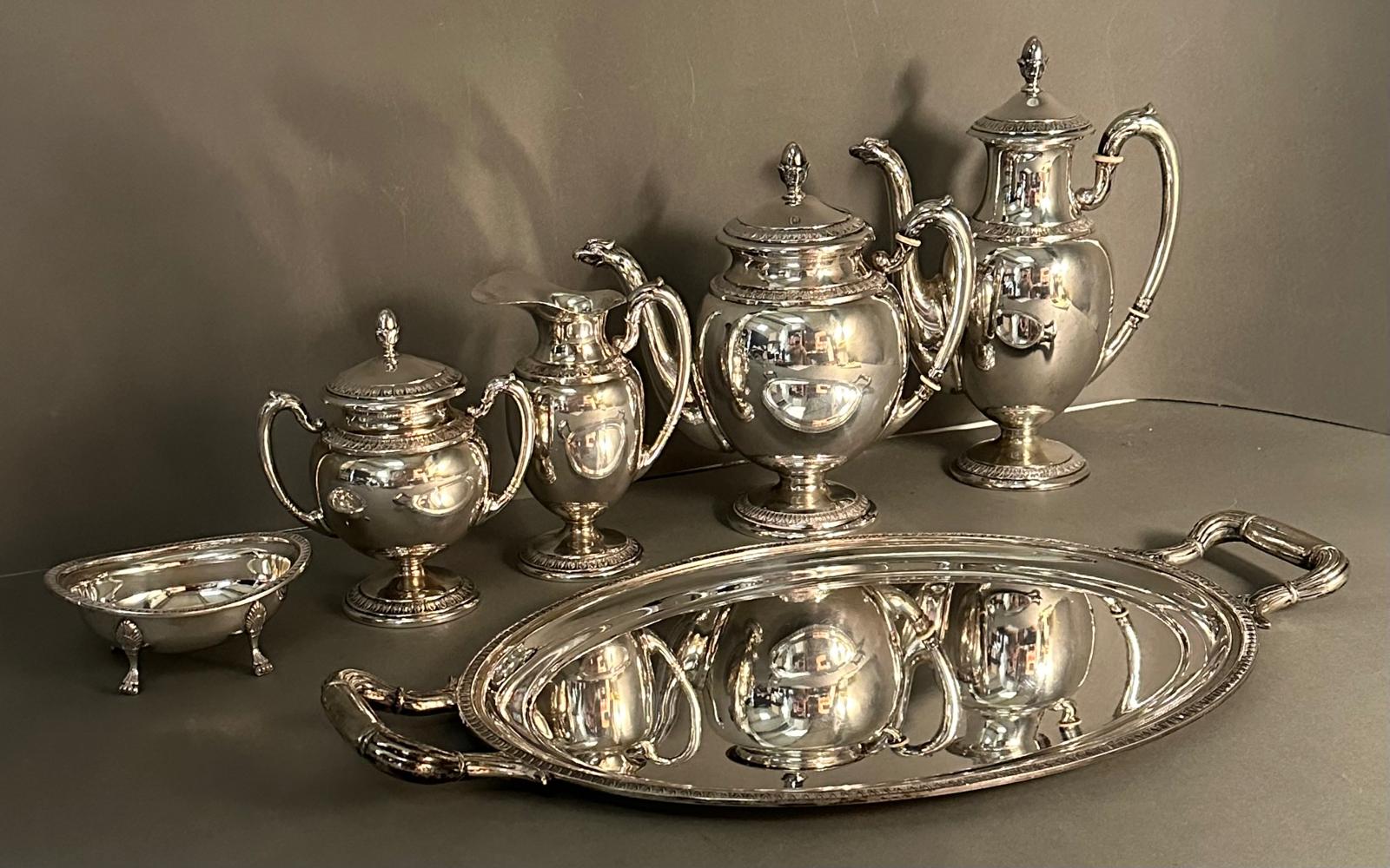 A continental silver tea and coffee service to include tray, tea and coffee pots and sugar bowl.