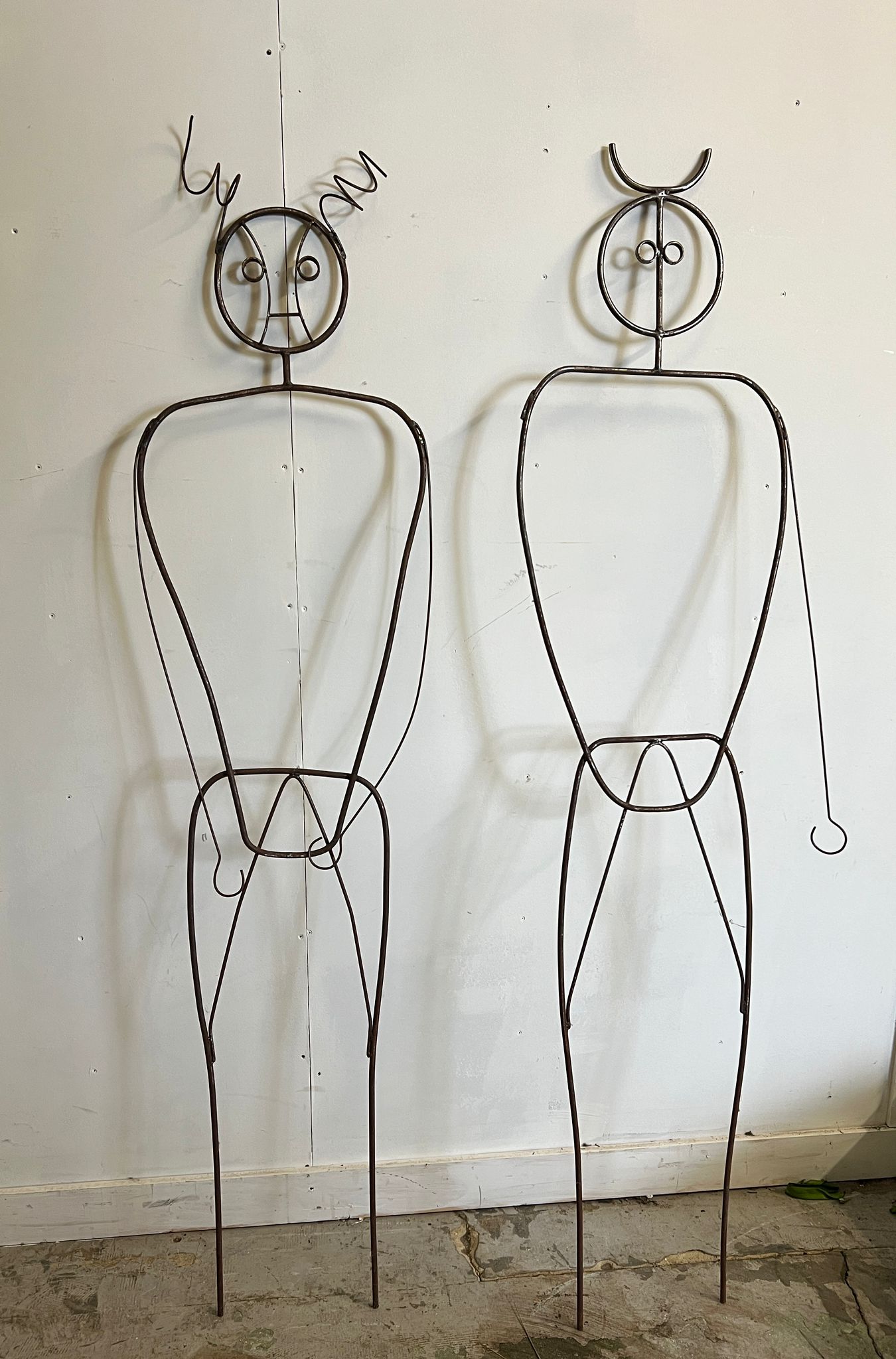 A post modern male and female iron mannequin
