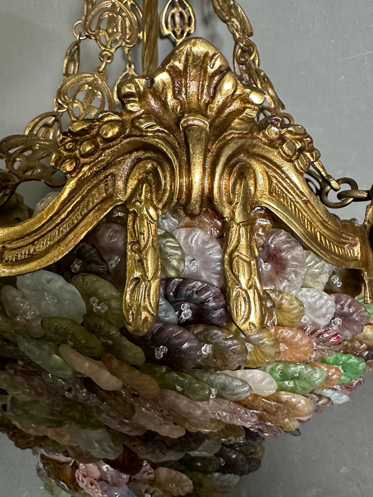 A Murano gilt brass and coloured glass chandelier in pinks, greens and purple. - Image 4 of 5
