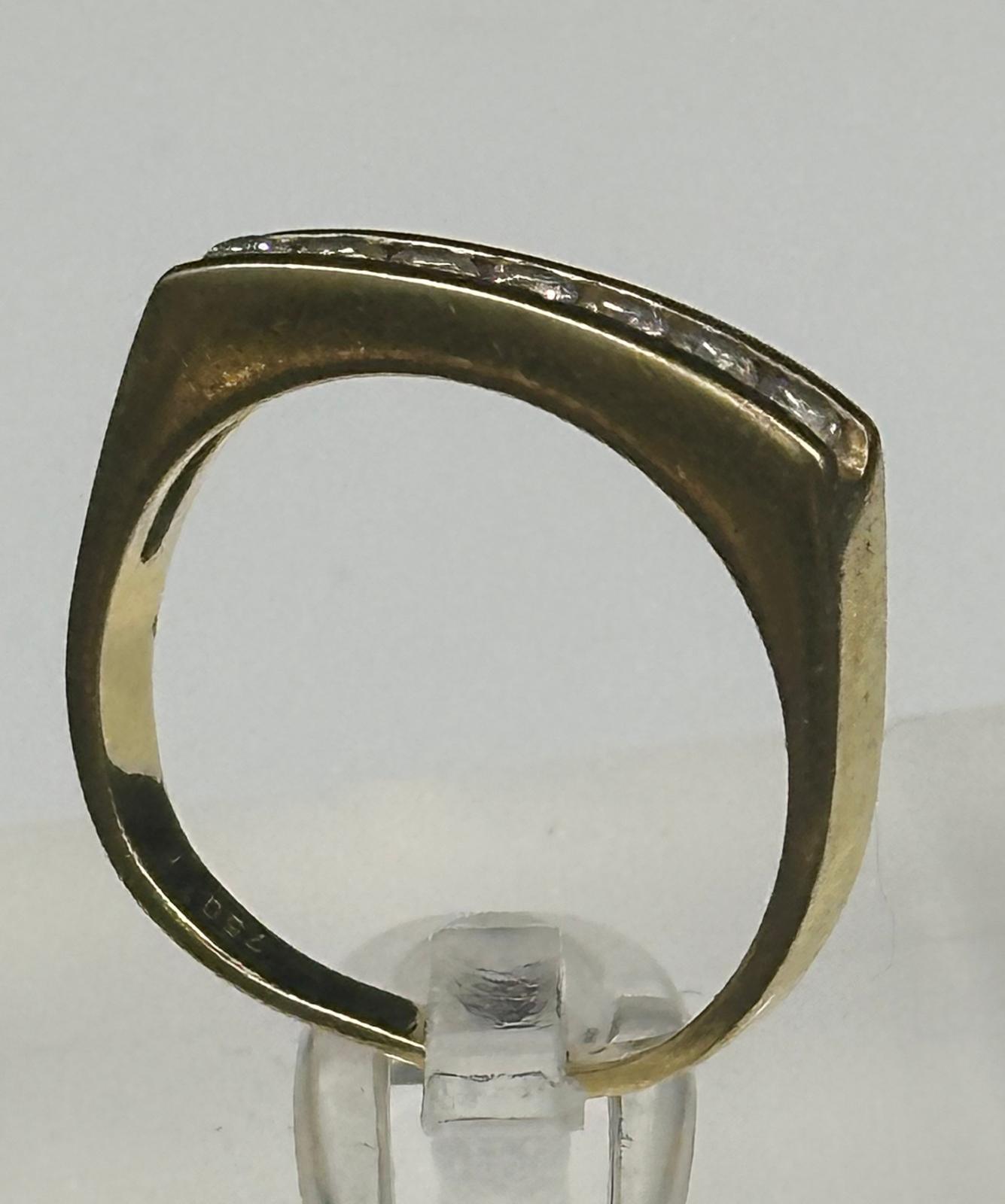 An 18ct gold ring with seven small diamonds and an approximate weight of 4.3g. Size N - Image 2 of 3