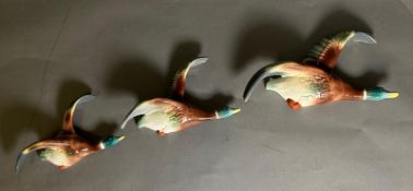 A set of three graduated ceramic flying ducks, marked H.O England to back